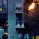 A young boy, potentially Shadow in a flashback, being confronted by a god.